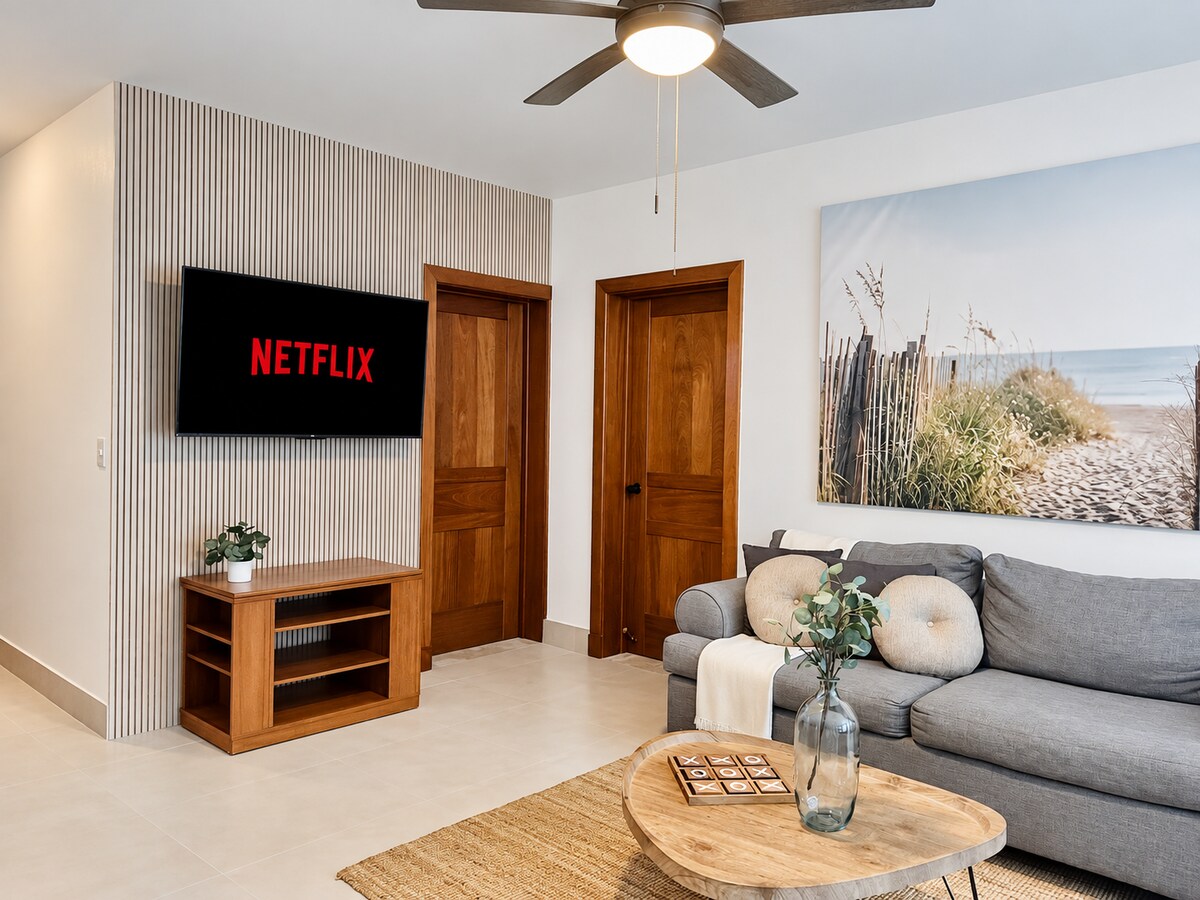 Air-conditioned living room with sofa and television