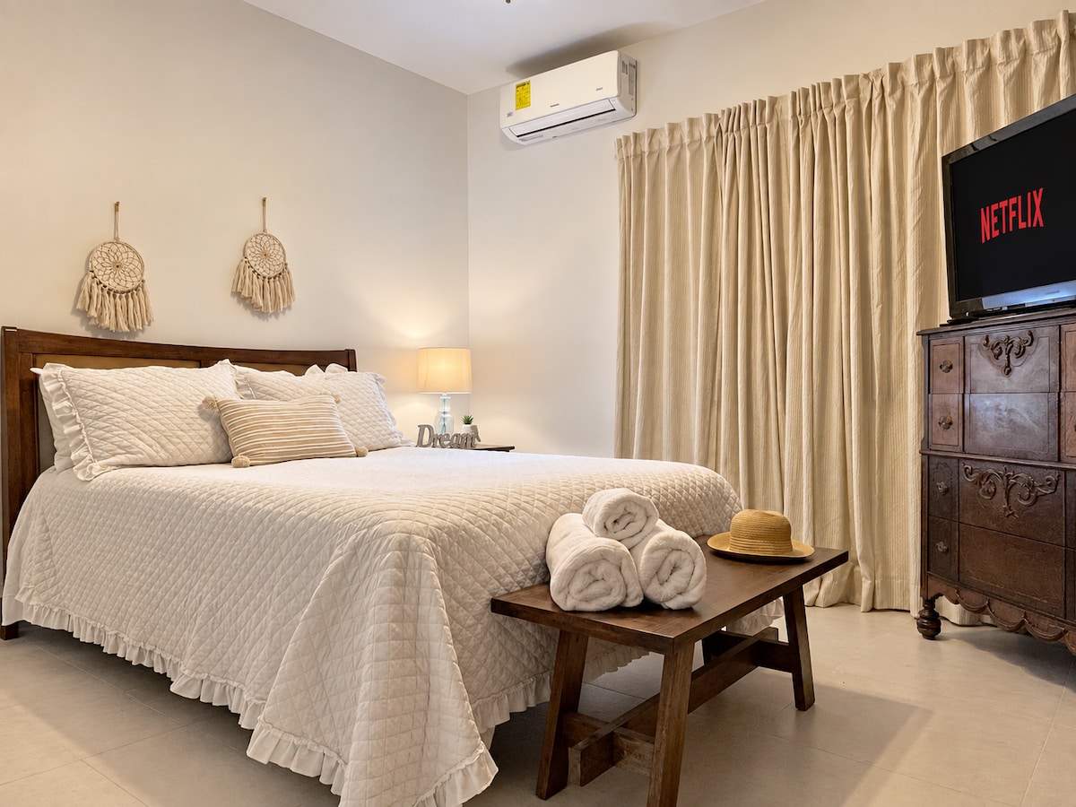 Second bedroom with queen bed and television