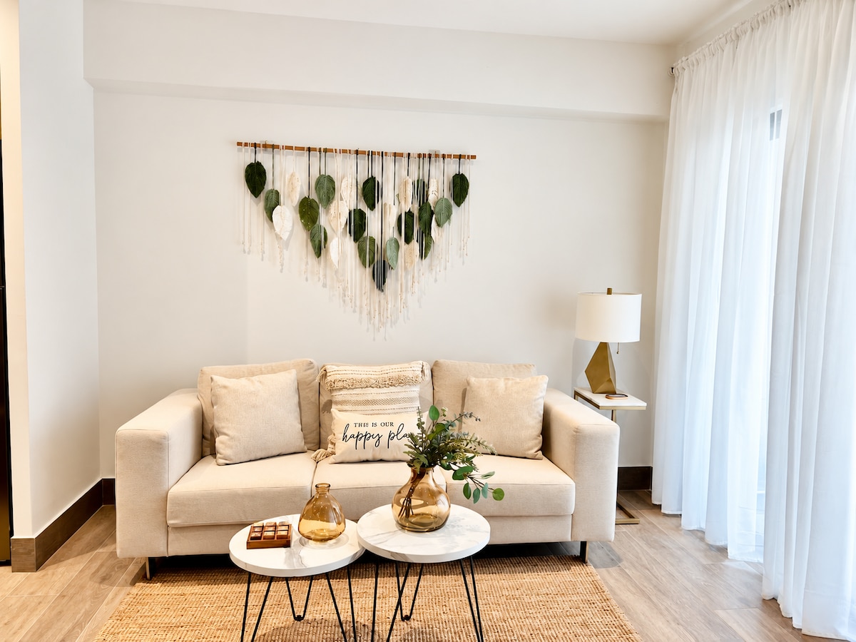 Bright living room with sofa and television