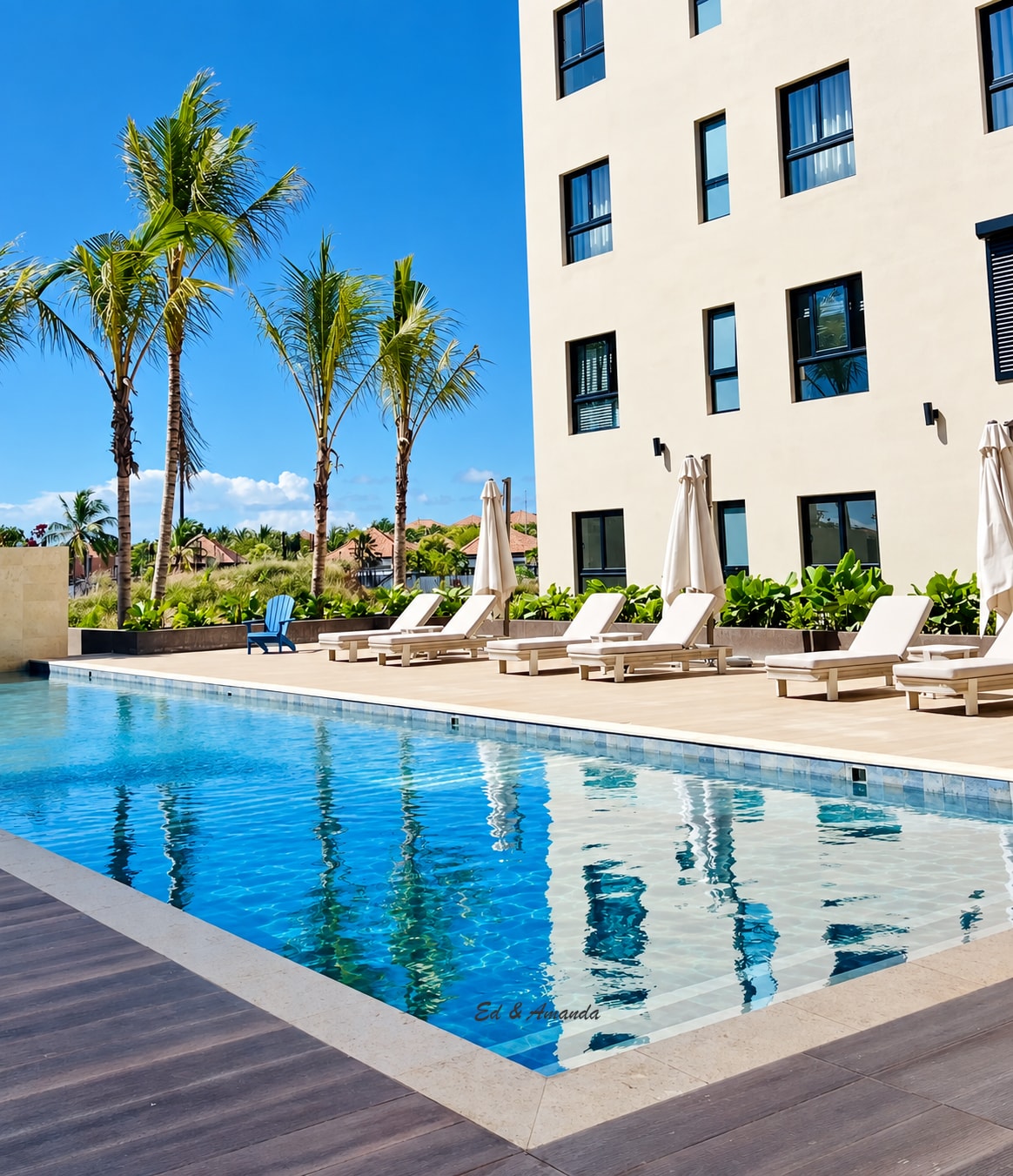 Sunny pool with loungers